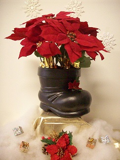 Santa boot with poinsettia arrangement
